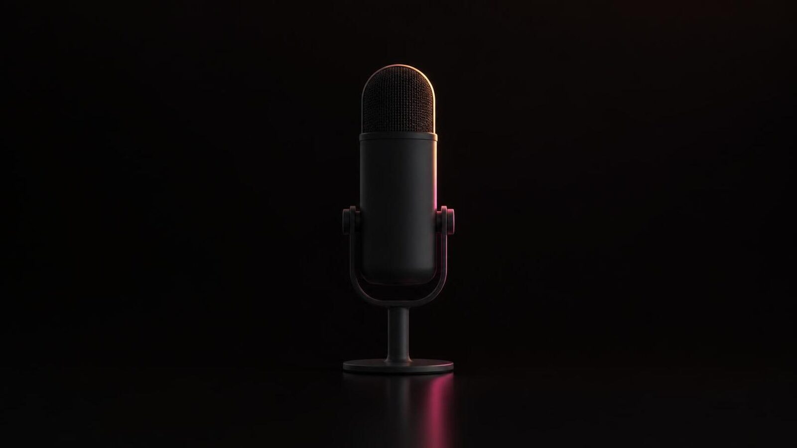 A single matte graphite studio microphone on a stand, centred on a near-black background, with a thin coral-to-magenta rim light along its right edge and a faint reflection below.